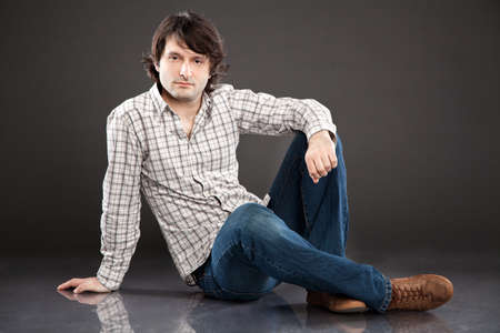 Handsome young man studio portraitの写真素材