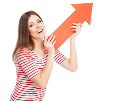 Young casual woman showing a direction with a red arrow