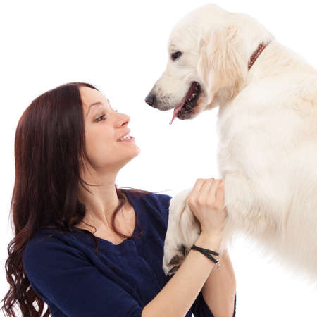 Beautiful young woman with golden retriever