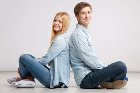 Beautiful young couple on white backgroundの写真素材