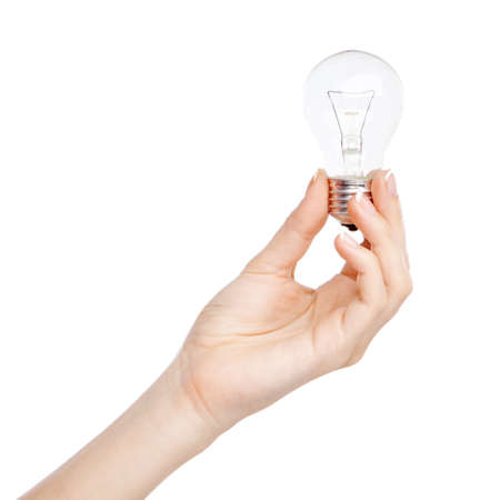 Female hand holding a light bulb, white backgroundの写真素材