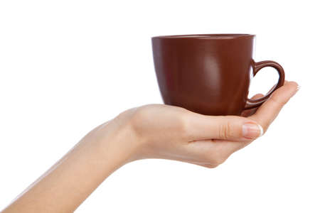 Hand holding a cup, isolated on white backgroundの写真素材