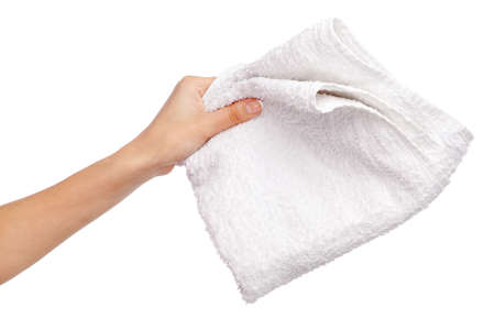 Female hand holding a white towel, isolated on white backgroundの写真素材