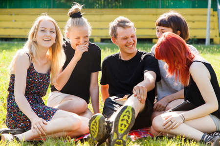 Group of students having fun in a parkの写真素材