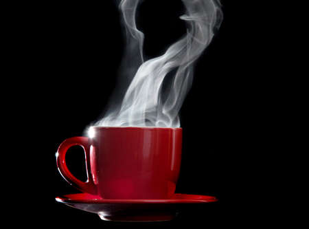 Steaming cup of coffee, black backgroundの写真素材