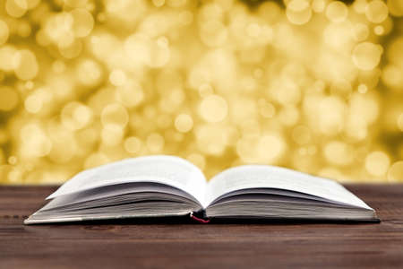 Open book on a wooden table