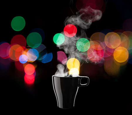 Black coffee cup isolated on black backgroundの写真素材