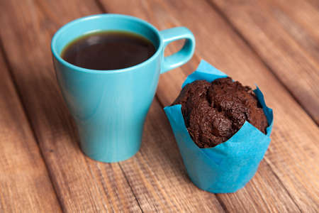 Chocolate muffin with coffee cupの写真素材