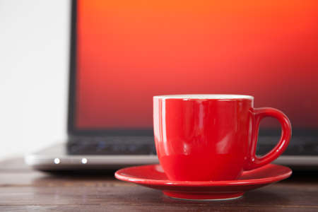 Laptop and a coffee cupの写真素材