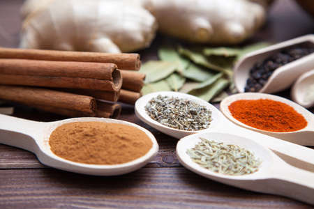 Spice assortment on a wooden tableの写真素材