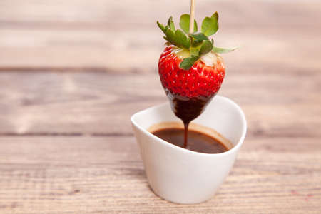 Fresh strawberries with hot chocolateの写真素材