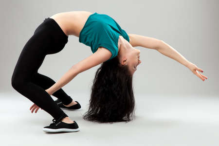 Professional dancer in studio on grey backgroundの写真素材