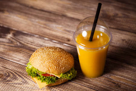 Delicious hamburger on a wooden tableの写真素材