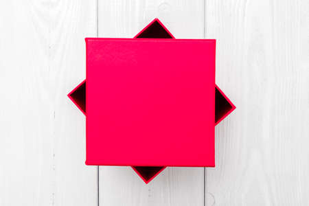 Pink gift box on white woodの写真素材