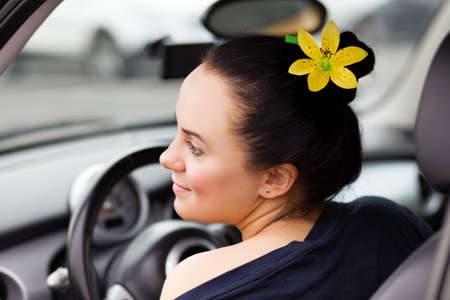 Young beautiful woman in a car