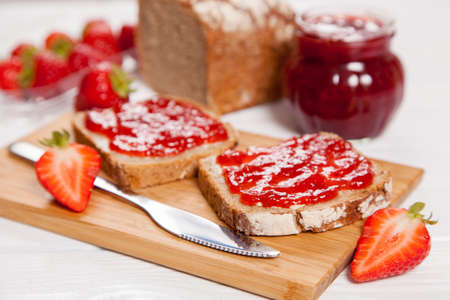 Delicious strawberry jam on breadsの写真素材