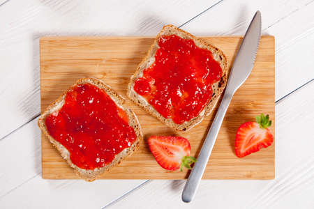 Delicious strawberry jam on breadsの写真素材