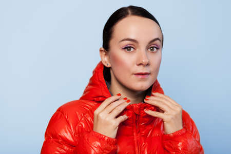 Face portrait of a woman in an autumn jacketの写真素材