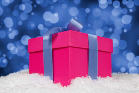 Christmas gift box in snow