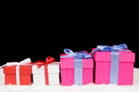 Christmas gift boxes in snow