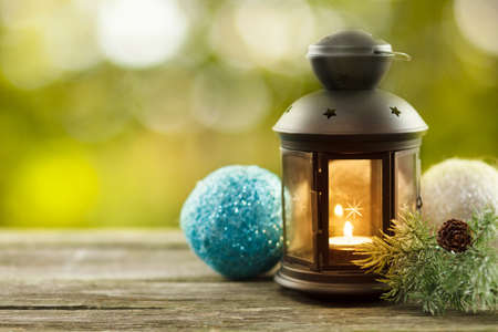 Vintage lantern with seasonal winter decorationの写真素材