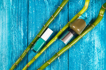 Nail polish on blue wood surfaceの写真素材