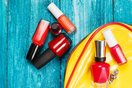 Nail polish on blue wood surfaceの写真素材