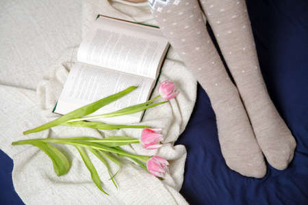 Female legs in warm woolen socks.