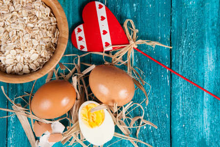 Organic eggs on blue wood background.の写真素材