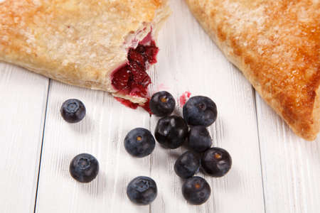 Sweet bake rolls on wooden table.の写真素材