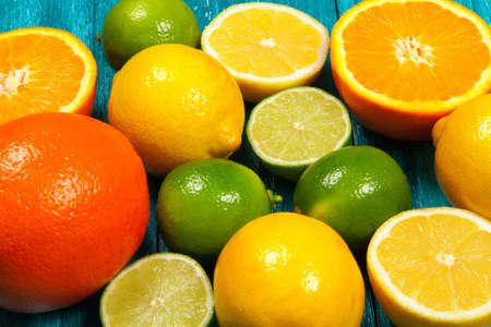 Assortment of citrus fruits on wooden surfaceの写真素材