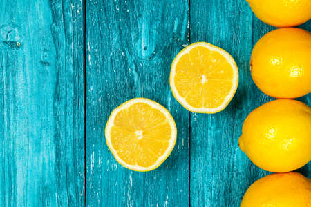 Assortment of citrus fruits on wooden surfaceの写真素材