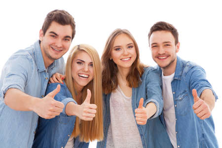 Group of happy young people showing thumbs up, isolated on white background
