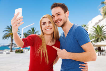 Young beautiful couple making a selfie
