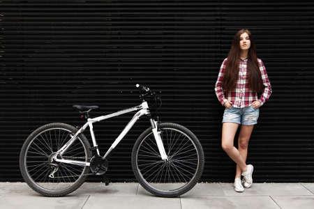 Young beautiful woman on a bicycle rideの写真素材