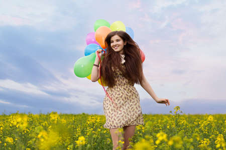 Young beautiful woman in the fields.の写真素材