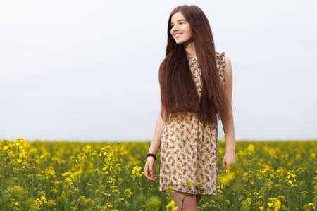 Young beautiful woman in the fields.の写真素材