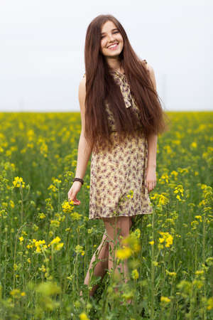 Young beautiful woman in the fields.の写真素材