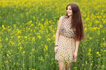 Young beautiful woman in the fields.の写真素材