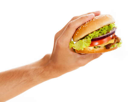 Hands holding a hamburger, isolated on white backgroundの写真素材