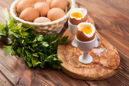 Boiled eggs on a wooden background.