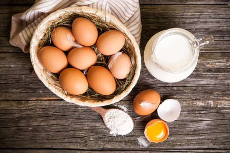 Fresh organic eggs in a basketの写真素材
