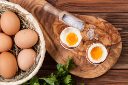 Boiled eggs on a wooden background.