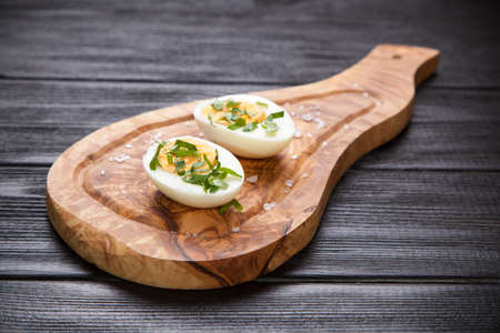 Boiled eggs on a cutting board.の写真素材