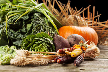 Assortment of green vegetables on wooden surface