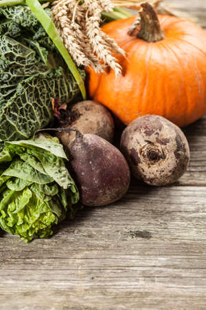 Assortment of green vegetables on wooden surfaceの写真素材