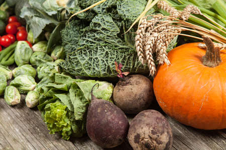Assortment of green vegetables on wooden surface