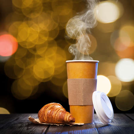 Takeaway coffee in a paper cupの写真素材