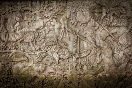 Ancient carved stone wall background with asian culture motives