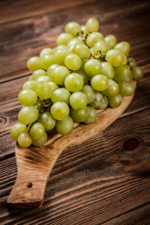 Delicious grapes on a domestic kitchen tableの写真素材